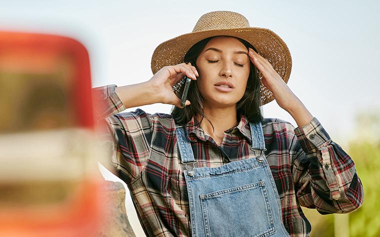 Stressed farmer in field