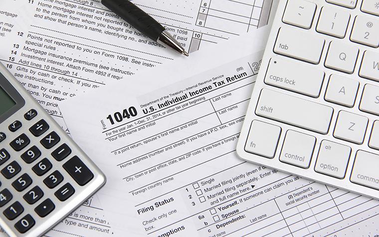 1040 tax form, calculator and keyboard