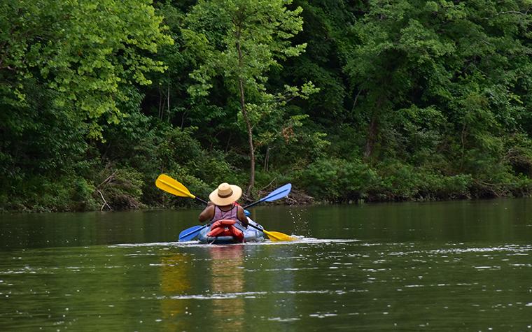 Man paddling on a body of water in Missouri.