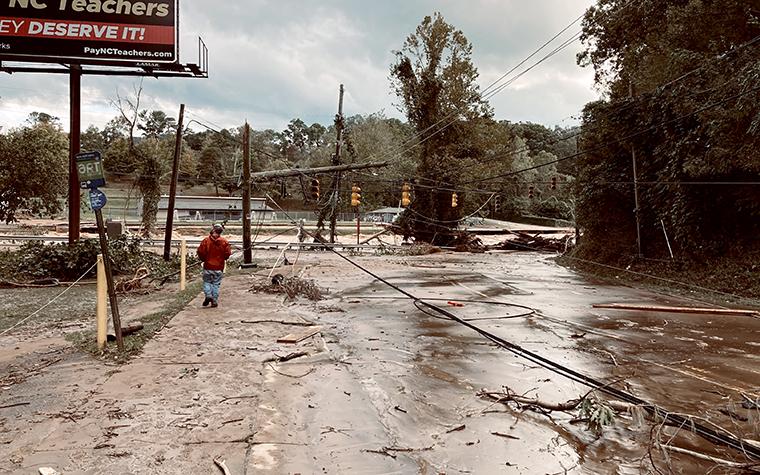 Damaged roads and powerlines after hurricane