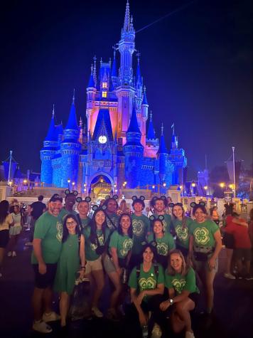 Group photo at Disney World castle.