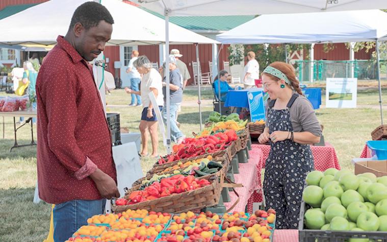 People browsing peppers