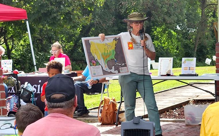 Women giving an outdoor presentation whilst holding a map