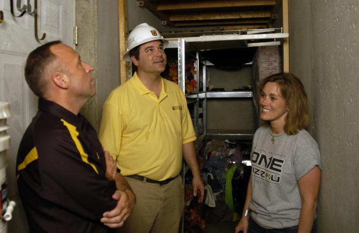 From left, Matt Adrian, MU Extension architect Jeff Barber and Claire Adrian in their safe room, which protected the Adrians and their children as the May 22 Joplin tornado destroyed their home. Curt Wohleber/MU Cooperative Media Group 