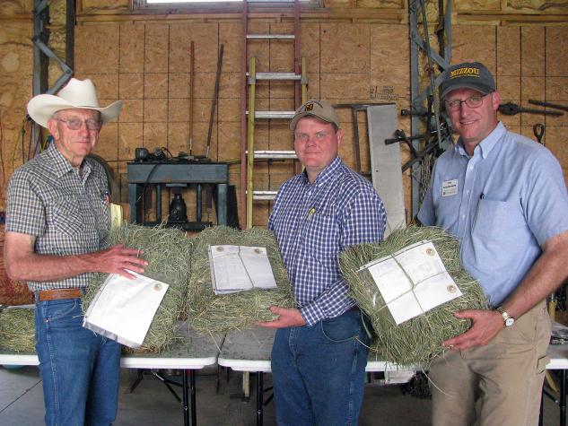 From left, MU Extension specialists Eldon Cole, Andrew McCorkill and Tim Schnakenberg show hay samples at a recent alfalfa tour. Not all good hay looks good. Not all hay that looks good is good hay. Testing tells.Photo by Linda Geist