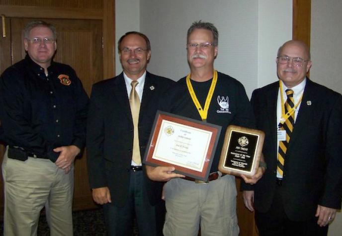 Jon Trent, second from right, was named MU FRTI Instructor of the Year for 2010-11. Also pictured, from left: State Fire Marshal Randy Cole; Kevin Zumalt, MU FRTI assistant director; and David Hedrick, director of MU FRTI. Courtesy MU Fire and Rescue Training Institute
