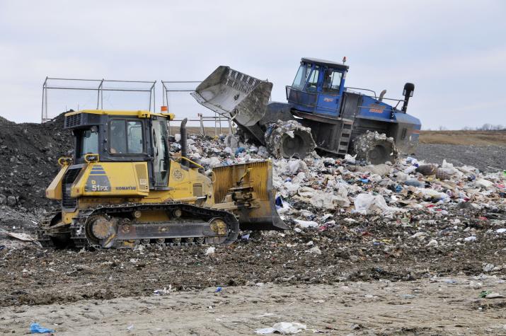 Bulldozers cover freshly dumped garbage at the Columbia, Mo., municipal landfill. Methane siphoned off the landfill generates enough electricity to power 1,500 homes.Roger Meissen/MU Cooperative Media Group
