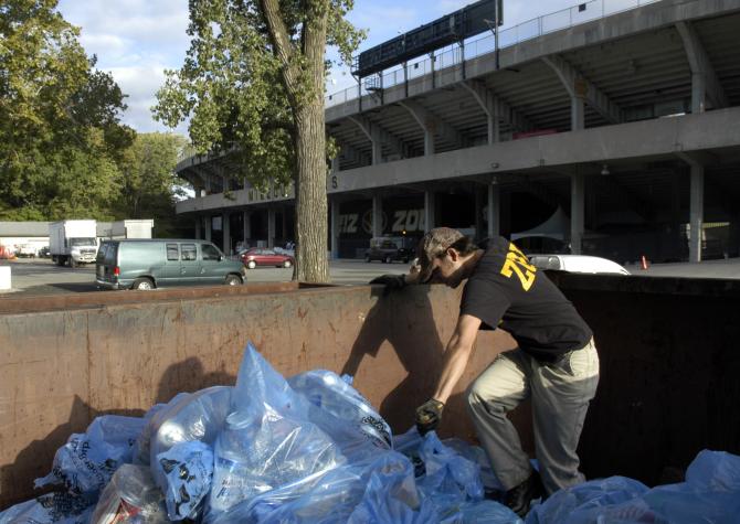 Andrew Daniels, first-year graduate student in parks, recreation and tourism, collects recycling bags from a dumpster behind Memorial Stadium the morning after the Sept. 13 home game against Arizona State. The game generated several tons of recyclable wasCurt Wohleber/MU Cooperative Media Group