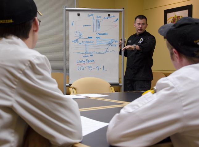 Leslie Jett, the MU executive chef and assistant teaching professor, prepares his students for their experience aboard the USS Boxer. Six hospitality management students will participate in the Adopt a Ship program.Jessica Salmond, MU Cooperative Media Group 