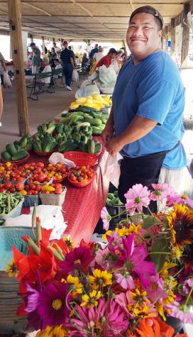 Fue Yang and his family sell produce and flowers at the Webb City Farmers Market. Yang runs a teaching farm for University of Missouri Extension, Lincoln University and the Webb City Farmers Market. Courtesy of Webb City Farmers Market.