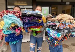 From left, Boone County 4-H'ers Chloe, Zoe and Jolie Beal carrying blankets for Project Linus.