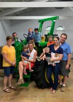 A permanent exhibit in the Missouri Farm Bureau building at the state fairgrounds features a tractor retrofitted with a rollover protection device and a looped video telling the story of Marion County farmer Ralph Griesbaum, who died in a 2018 tractor rol