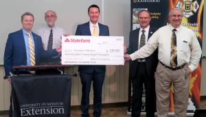 From left: Jake Logan, assistant vice chancellor for university programs; Sandy Rikoon, dean, College of Human Environmental Sciences; Ryan Kenney, State Farm agency sales leader for northeastern Missouri; Kevin Zumwalt, associate director, Fire and RescuMU Extension