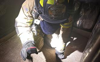 Firefighter with thermal imaging camera