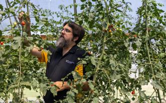 Justin Keay looking at plants