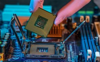 fingers clutching a microchip