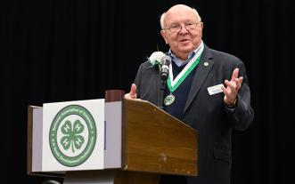 Russ Weathers at podium