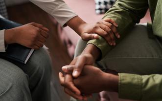Close-up of hands of two people in earnest conversation