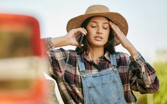 Stressed farmer in field
