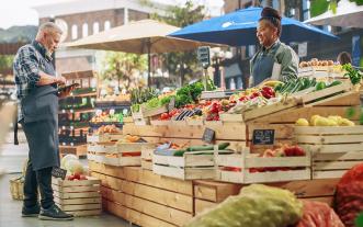 Woman and customer at a farmers market