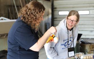 Tatijana Fisher demonstrates egg candling