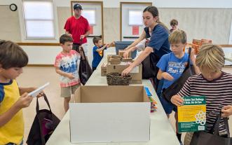 Youths stocking care bags for seniors