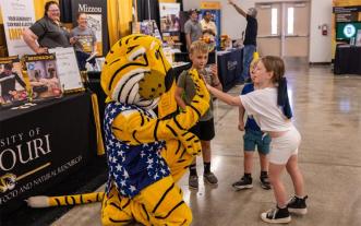 Truman the Tiger with kids