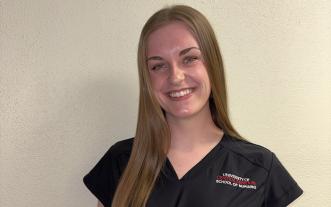 Zoe Engelbrecht in scrubs
