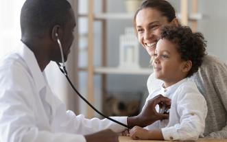 Pediatrician with mother and child