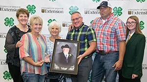 Family receiving 4-H Hall of Fame award