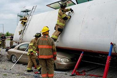 Fire fighters training rescuing people from a bus crash.