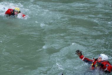 Fire fighters training a water rescue.