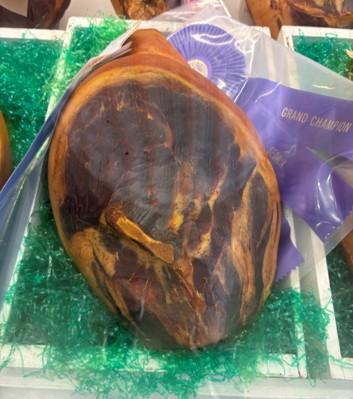 A country cured ham on a table for display
