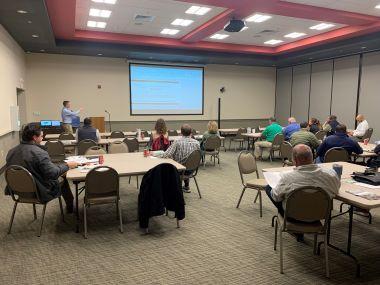 Man giving a lecture in a conference room