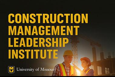 Male & female construction workers having a conversation.