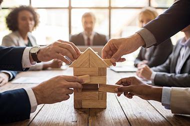 A corporate team playing Jenga.