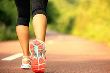 A woman wearing tennis shoes on a track