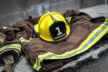 Firefighter's helmet and uniform laid out in memoriam