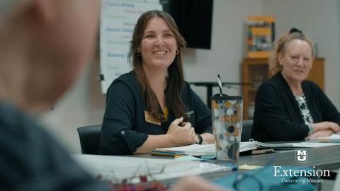 people in the chronic condition class talking and smiling