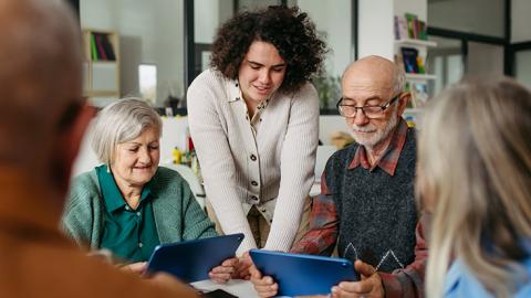person teaching seniors about security