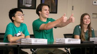 youth with thumbs up