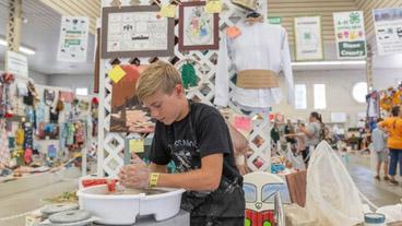 student working on 4-H project