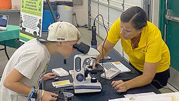 4-H Science program with microscope