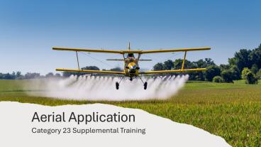 Airplane flying low above a field applying pesticide.