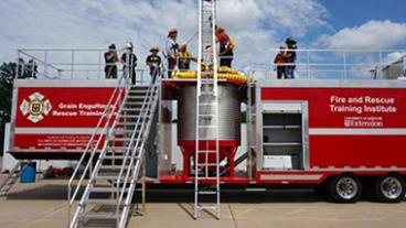 Fire fighters training a rescue in a grain elevator.