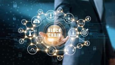 Hand with Blockchain working and graphics around it