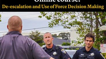 Two officers talking to a man.