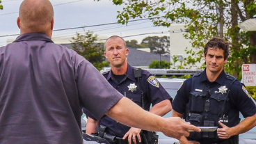two police officers confronting someone