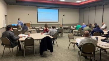 Man giving a lecture in a conference room