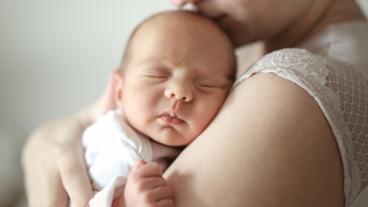 baby sleeping with mom
